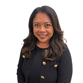 About Dr. Melinda Silva: Woman with long dark hair wearing a black jacket with gold buttons, smiling and standing against a plain white background. About Dr. Melinda Silva: Woman with long dark hair wearing a black jacket with gold buttons, smiling and standing against a plain white background.