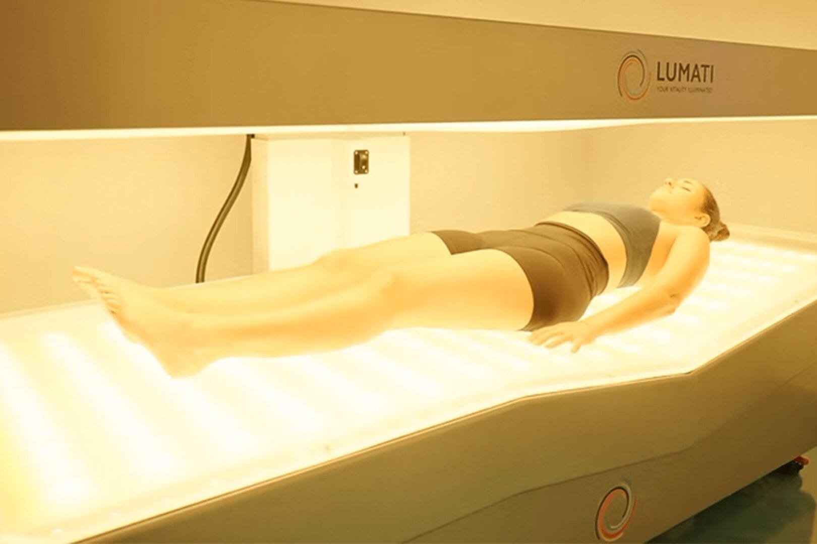 Lumati PBM bed with green light for wellness